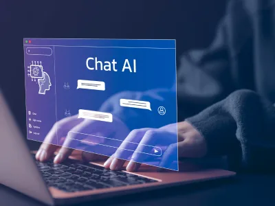 شخص يكتب على حاسوب محمول مع ظهور تطبيق Chat AI على الشاشة. يتميز بتصميم أنيق وعصري مع إضاءة زرقاء تُبرز اليدين. النص: "Chat AI"