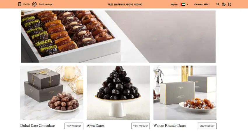 يعرض قسم رئيسي في الموقع الإلكتروني خيارات منتجات التمور، بما في ذلك "شوكولاتة تمر دبي" و"تمور العجوة" و"تمور الرطب من نان" مع أزرار "عرض المنتج". ويعلن الشريط العلوي عن "شحن مجاني للطلبات التي تزيد قيمتها عن 100 درهم إماراتي".